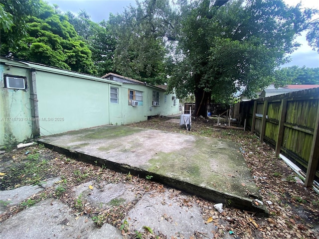 view of yard featuring cooling unit and a patio area