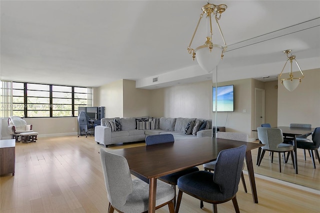 dining room featuring light hardwood / wood-style flooring