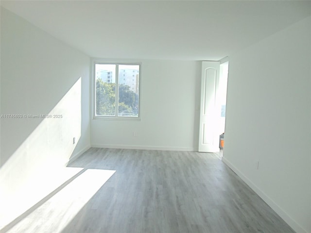 unfurnished room featuring light wood-type flooring