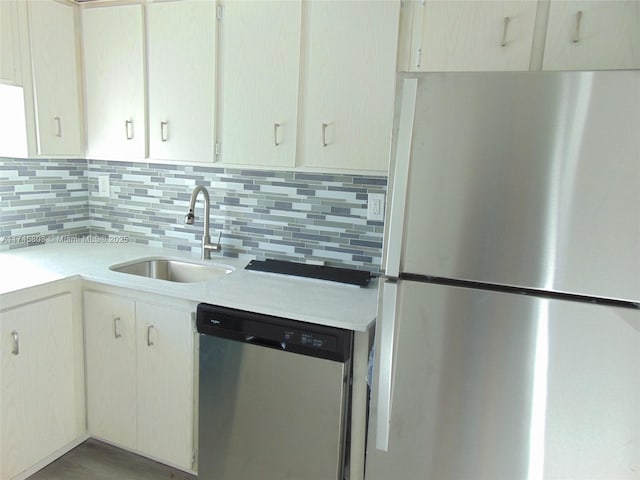 kitchen with tasteful backsplash, sink, and stainless steel appliances