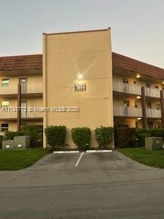 view of outdoor building at dusk