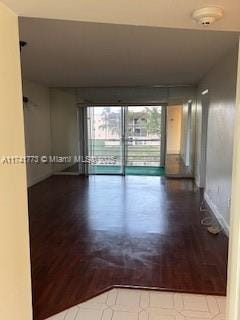 spare room with hardwood / wood-style flooring