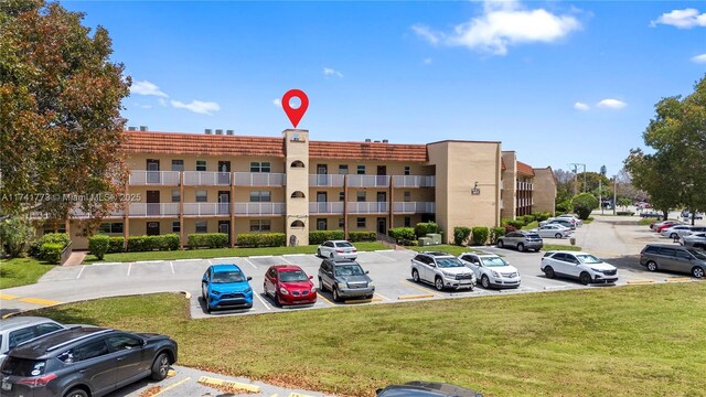 2811 N Pine Island Rd Unit 302, Sunrise, FL 33322 - view of property with uncovered parking