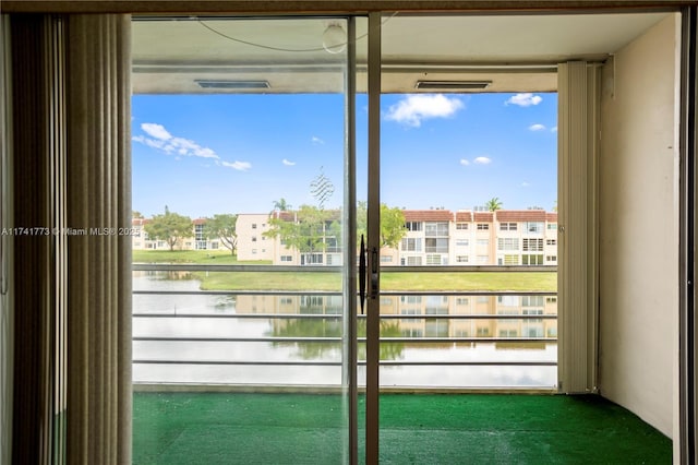 2811 N Pine Island Rd Unit 302, Sunrise, FL 33322 - entryway with a water view and carpet