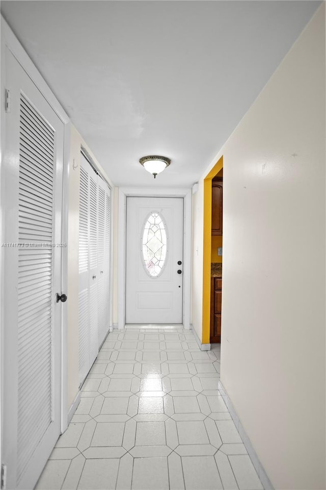 2811 N Pine Island Rd Unit 302, Sunrise, FL 33322 - entryway with baseboards and light floors