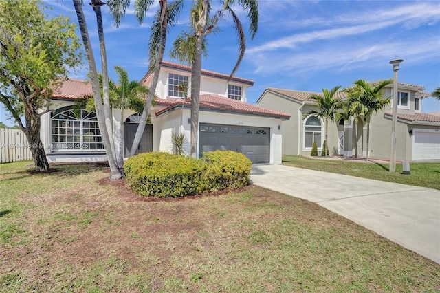 mediterranean / spanish-style house featuring a garage, a tile roof, a front lawn, and stucco siding