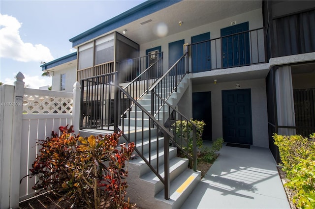 7511 S Oriole Blvd Unit 201, Delray Beach, FL 33446 - view of exterior entry with stucco siding