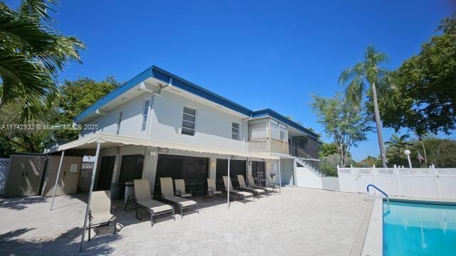 7511 S Oriole Blvd Unit 201, Delray Beach, FL 33446 - back of house featuring a patio area and stairs