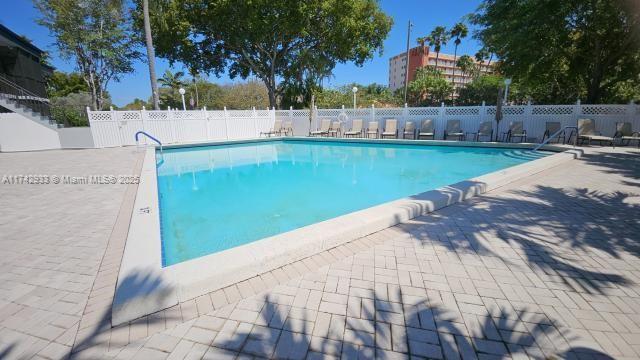 7511 S Oriole Blvd Unit 201, Delray Beach, FL 33446 - community pool with a patio area