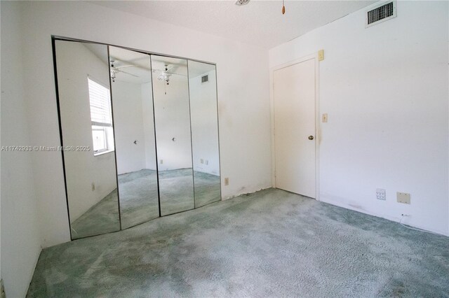 7511 S Oriole Blvd Unit 201, Delray Beach, FL 33446 - unfurnished bedroom featuring carpet and a closet