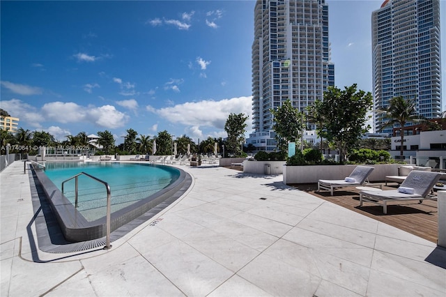 view of swimming pool with a patio area