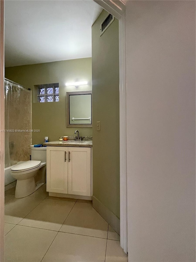 full bathroom with vanity, toilet, tile patterned flooring, and shower / bath combo