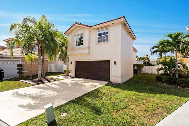 mediterranean / spanish-style house with a garage and a front lawn