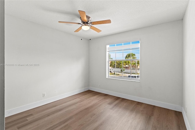 17356 SW 21st St, Miramar, FL 33029 - empty room featuring wood finished floors, a ceiling fan, and baseboards
