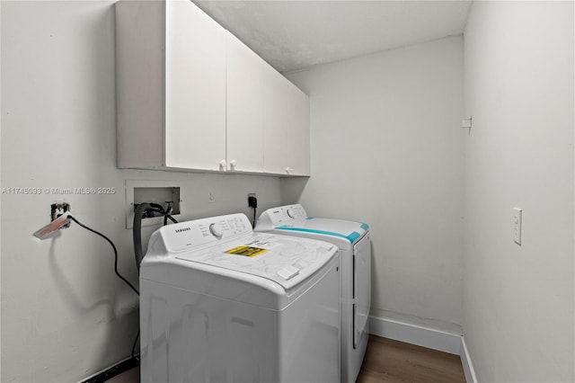 17356 SW 21st St, Miramar, FL 33029 - laundry area featuring cabinet space, washer and clothes dryer, and wood finished floors