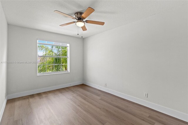 17356 SW 21st St, Miramar, FL 33029 - empty room featuring wood finished floors, a textured ceiling, and ceiling fan