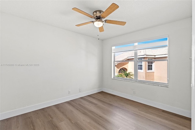 17356 SW 21st St, Miramar, FL 33029 - empty room with wood finished floors, baseboards, and a ceiling fan