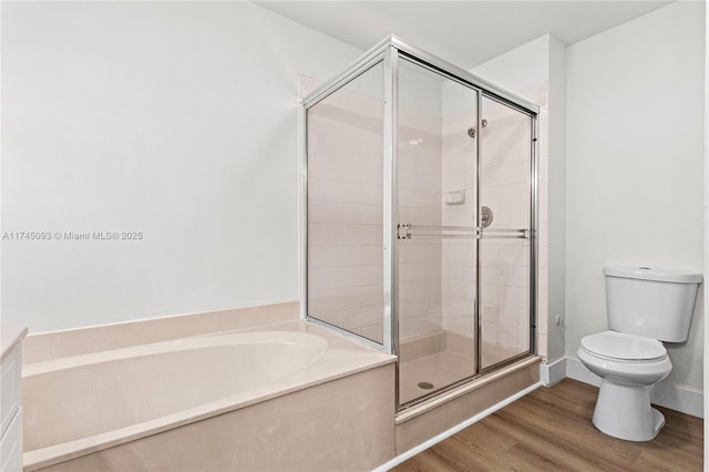 bathroom featuring hardwood / wood-style flooring, independent shower and bath, and toilet