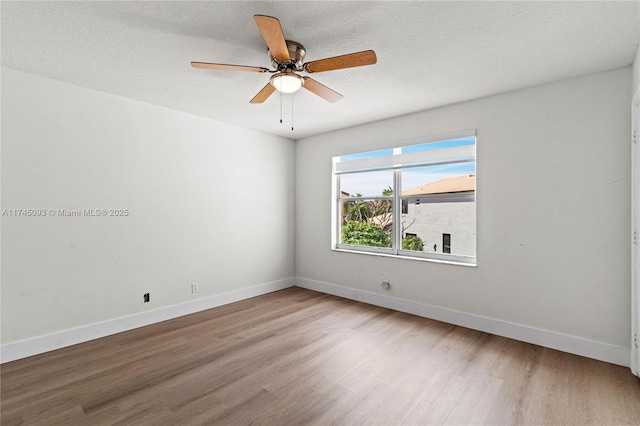 17356 SW 21st St, Miramar, FL 33029 - unfurnished room featuring wood finished floors, baseboards, and a ceiling fan