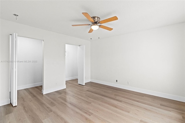 unfurnished bedroom featuring ceiling fan and light wood-type flooring