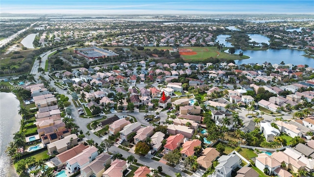 birds eye view of property featuring a water view