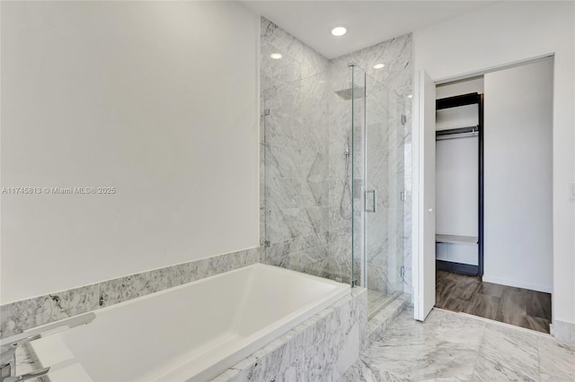 bathroom featuring plus walk in shower