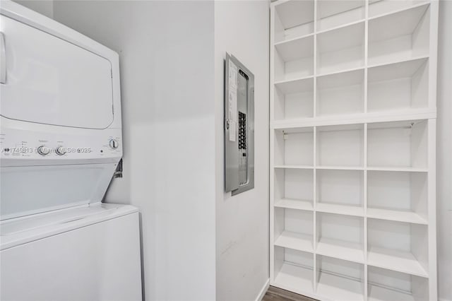 clothes washing area with stacked washer / drying machine