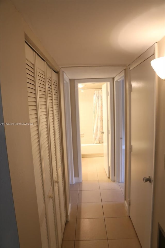 hallway featuring light tile patterned flooring