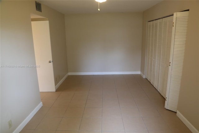 hall with light tile patterned flooring