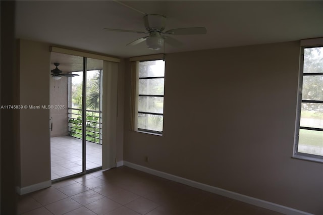 tiled empty room with ceiling fan