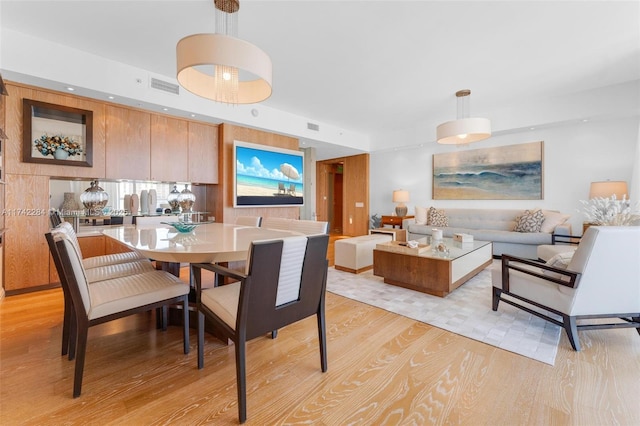 dining area featuring light wood-style floors, visible vents, and recessed lighting