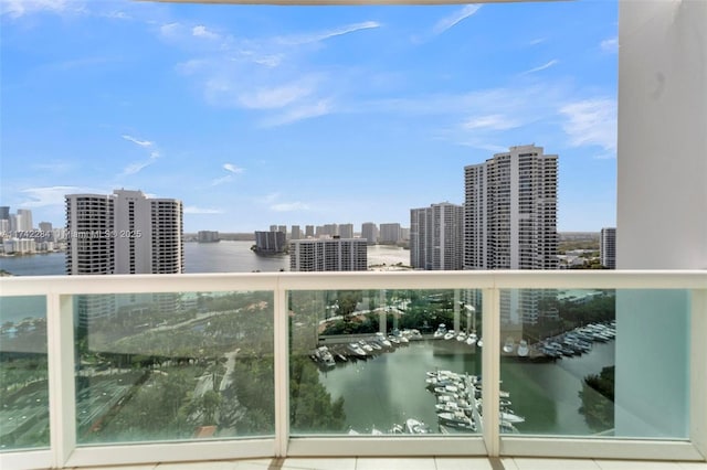 balcony featuring a water view and a view of city