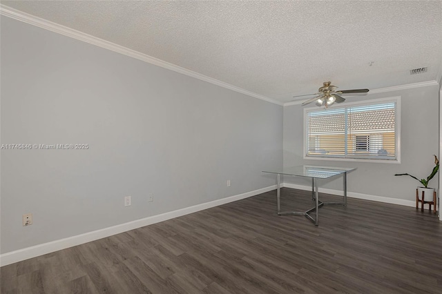 unfurnished room featuring crown molding, a textured ceiling, baseboards, and dark wood-style flooring