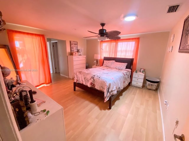 bedroom featuring wood-type flooring and ceiling fan