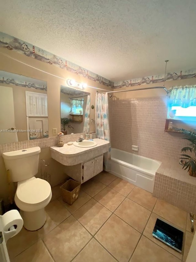 full bathroom with tile patterned floors, toilet, sink, a textured ceiling, and shower / bath combo