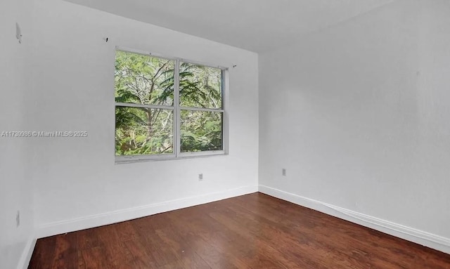 spare room featuring hardwood / wood-style flooring