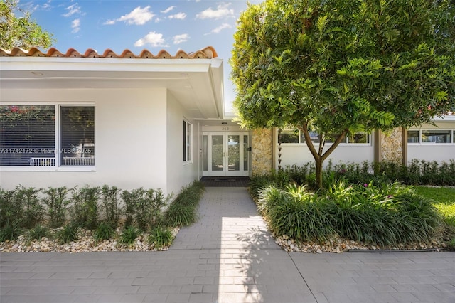 doorway to property featuring french doors