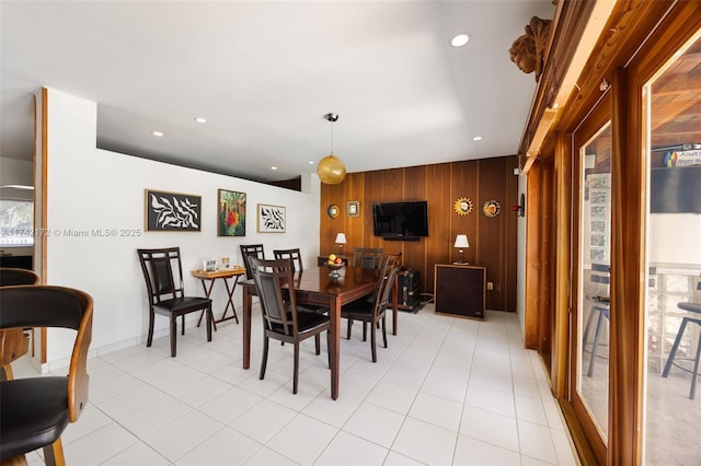 dining area with wood walls