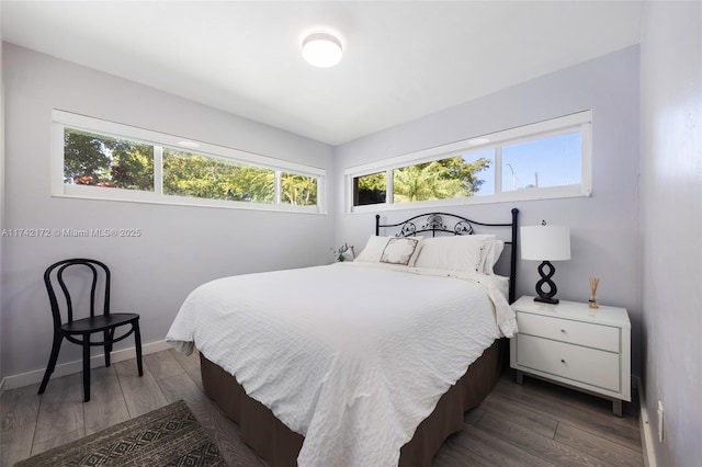 bedroom featuring dark hardwood / wood-style floors