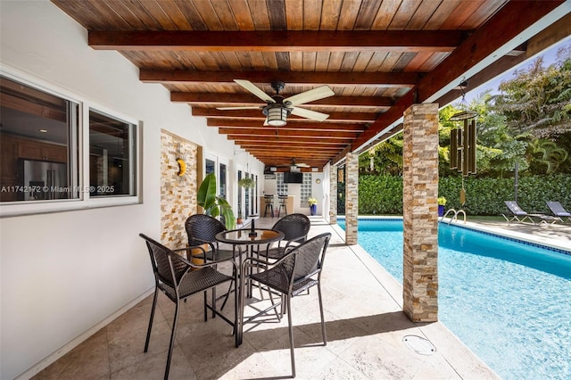 view of patio featuring ceiling fan