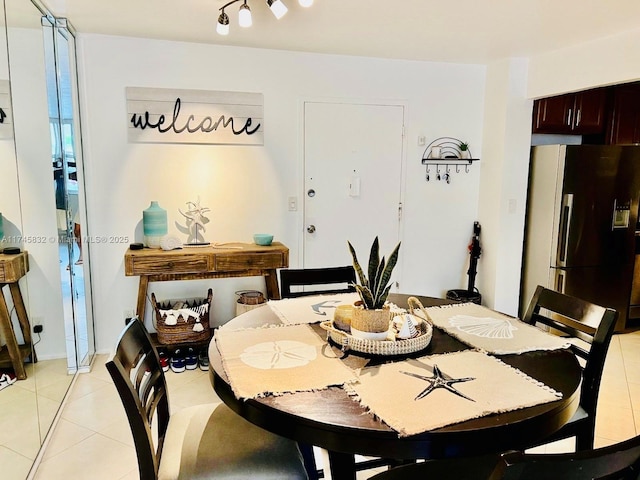 dining area featuring light tile patterned floors