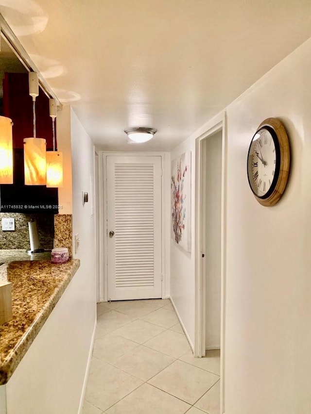 corridor with light tile patterned floors