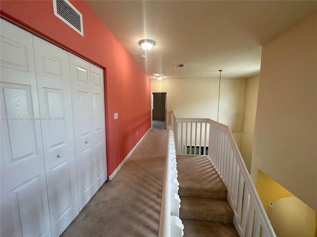 corridor featuring carpet flooring