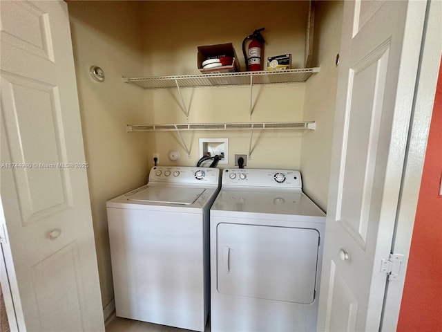 laundry room with washing machine and clothes dryer