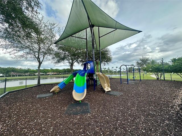 view of jungle gym featuring a water view