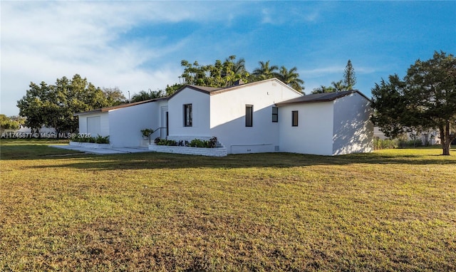 view of property exterior featuring a yard