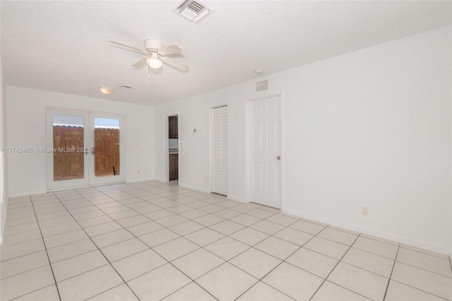 1300 NW 7th Pl, Fort Lauderdale, FL 33311 - spare room featuring a ceiling fan, french doors, light tile patterned floors, and a textured ceiling