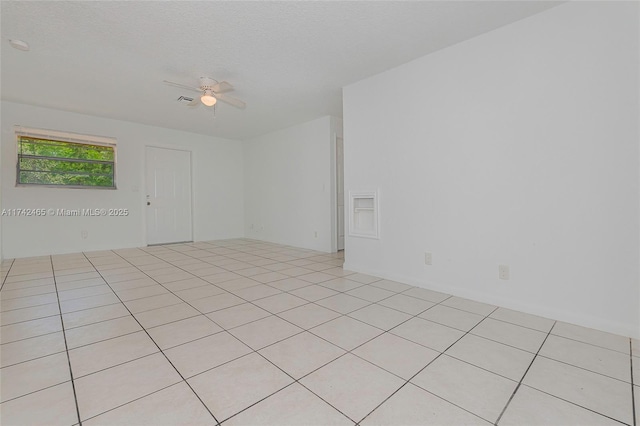 1300 NW 7th Pl, Fort Lauderdale, FL 33311 - empty room with ceiling fan and light tile patterned floors