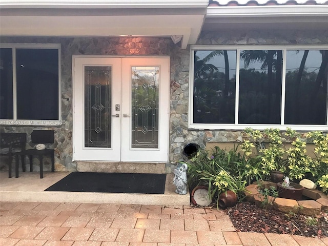 1155 S Biscayne Point Rd, Miami Beach, FL 33141 - property entrance with stone siding and french doors