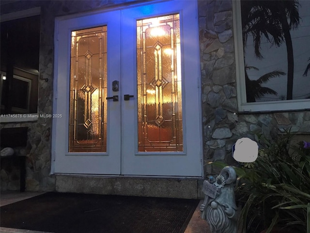 1155 S Biscayne Point Rd, Miami Beach, FL 33141 - property entrance with french doors and stone siding